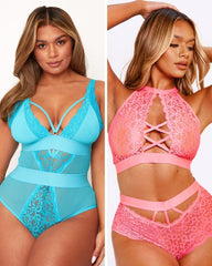 Two women wearing blue and pink lace lingerie sets on a plain background