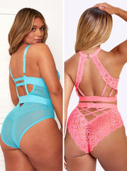 Two women wearing strappy lingerie in blue and pink.