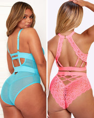 Two women wearing strappy lingerie in blue and pink.