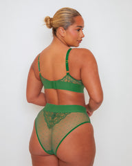 Back view of the Abigail lingerie set in Amazon Green, featuring a sheer polka-dot mesh brief with lace detailing, a wide waistband, and a matching bralette with adjustable straps and a lace racerback-inspired design.