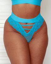 Close-up front view of the Amber Thong in Bluebird Blue, featuring a wide high-rise waistband, decorative strappy cut-out detailing, floral lace panels, and a sheer mesh front insert.
