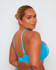Angled back view of the Daley Lace T-Shirt Bra in Bluebird Blue, showcasing the supportive contour cups, soft lace trim, and flattering high-leg thong silhouette.