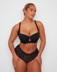 Angled front view of the Daley T-Shirt Bra and Venus Short in Midnight Black, highlighting the supportive contour cups, feminine lace accents, and the comfortable full-coverage short silhouette.
