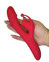 Red silicone Personal Toy held by a hand on a white background