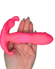 Hand holding a pink silicone product against a white background