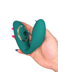 Teal silicone personal massager adult toy held in a hand with a white background