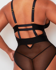 Close-up back detail of the Alicia Bodysuit in Black by Tutti Rouge, featuring adjustable straps with gold-tone heart sliders, sheer mesh panels, and striking strappy back accents.