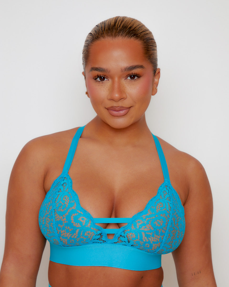 Close-up of the Amber Fuller Bust Bra in Bluebird Blue, featuring soft floral lace cups, decorative front strap detailing, adjustable shoulder straps, and a supportive underband designed for fuller busts.