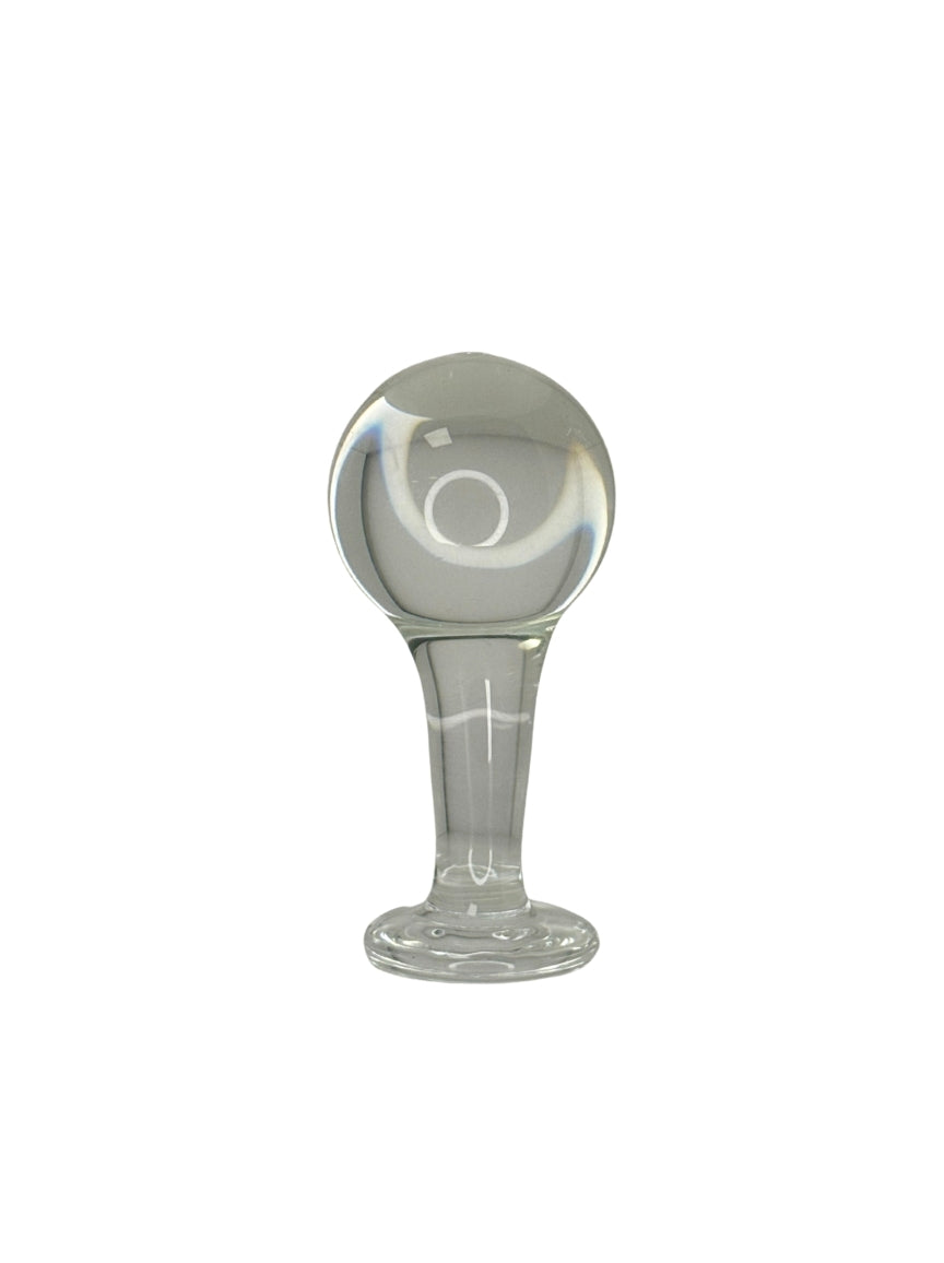 Clear glass Butt Plug with a cylindrical base and spherical top on a white background