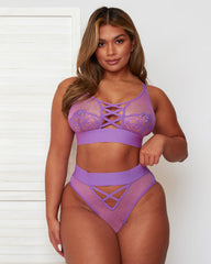 Front view of the Abigail lingerie set in Amethyst Orchid, featuring a sheer polka-dot mesh bralette with lace-lined cups, criss-cross front strap detailing, adjustable straps, and a matching high-waisted brief with sheer mesh panels and decorative front strapping.