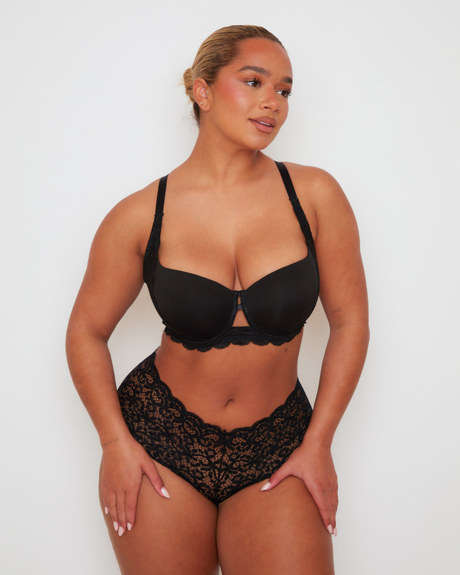 Angled front view of the Daley T-Shirt Bra and Venus Short in Midnight Black, highlighting the supportive contour cups, feminine lace accents, and the comfortable full-coverage short silhouette.