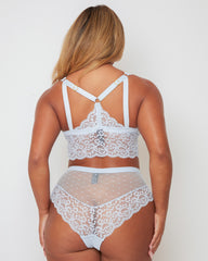 Back view of the Eva Bralette and Brief set in Ballad Blue, featuring a decorative lace racerback-inspired detail, adjustable straps, and matching briefs with sheer dotted mesh and floral lace accents.