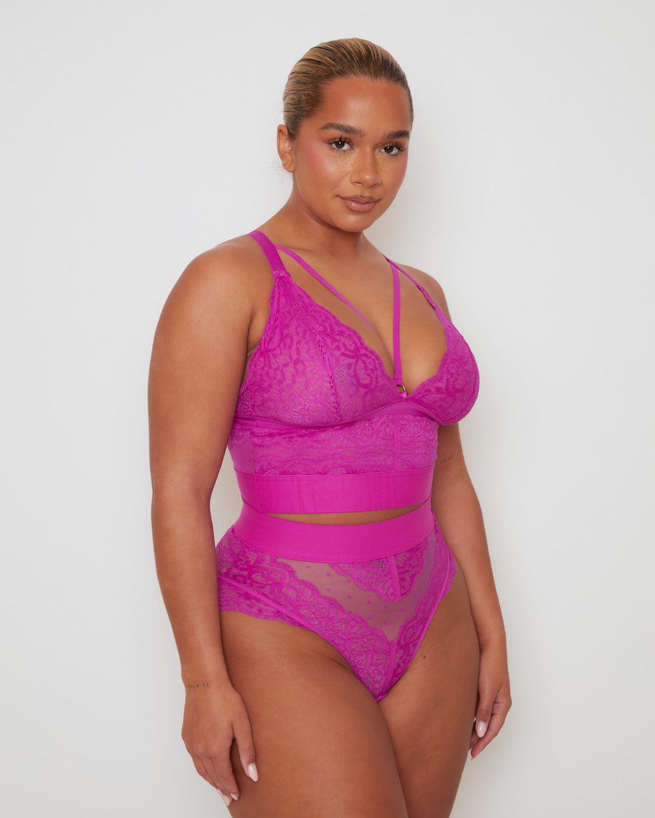 Three-quarter view of the Gia Bralette & Brief Set, highlighting the flattering longline bralette, wide smoothing waistband, and high-leg lace brief in a striking Vibrant Purple colourway.