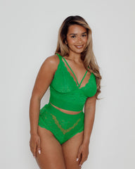 Close-up of a Harlequin Green lace bralette featuring scalloped lace cups, supportive wide underband, and elegant strappy neckline detail for fuller bust support.