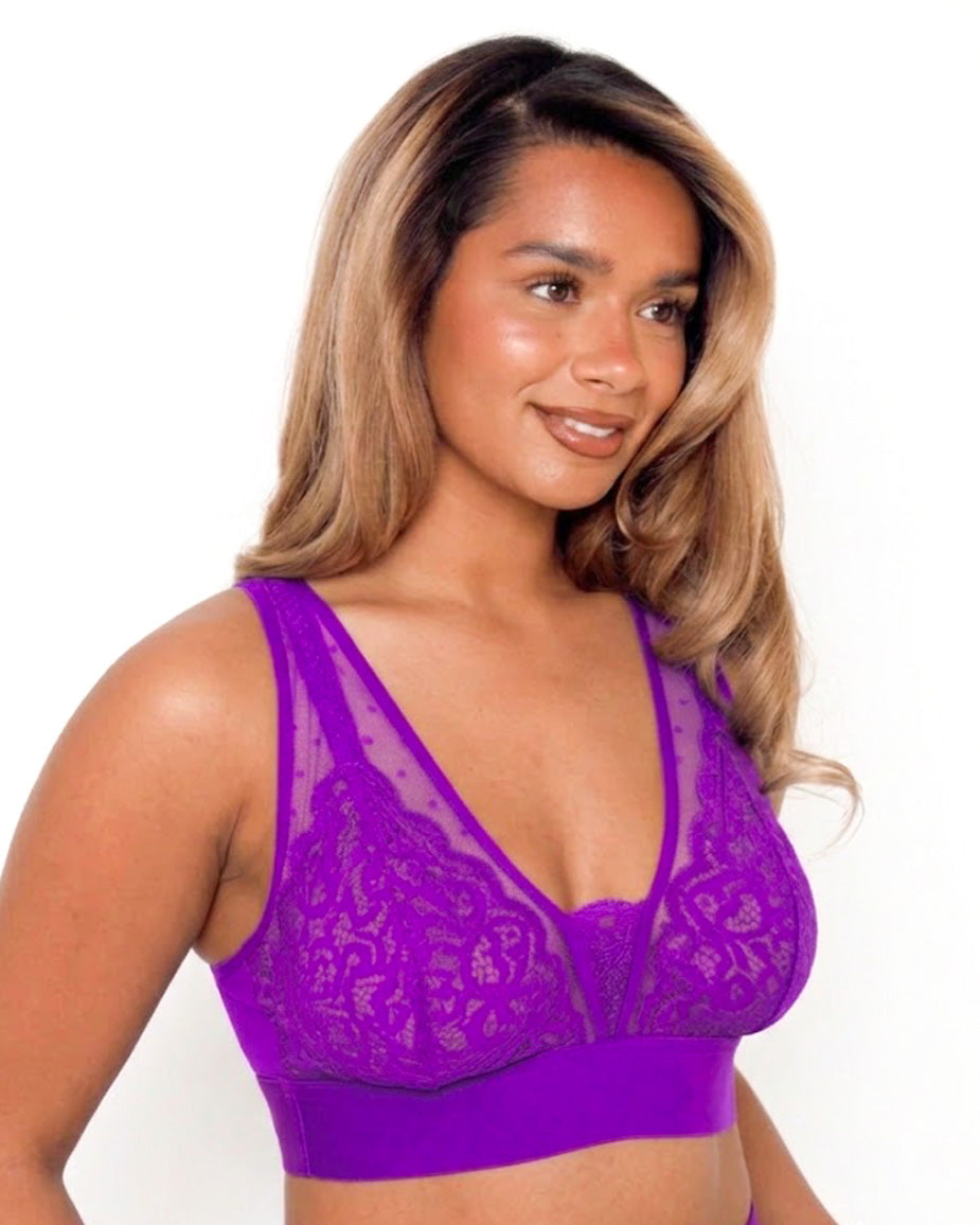 Model wearing the Hallie Fuller Bust Lace Bralette in Passion Purple, featuring delicate floral lace, sheer mesh panels, wireless support and a wide comfort underband designed for fuller busts.