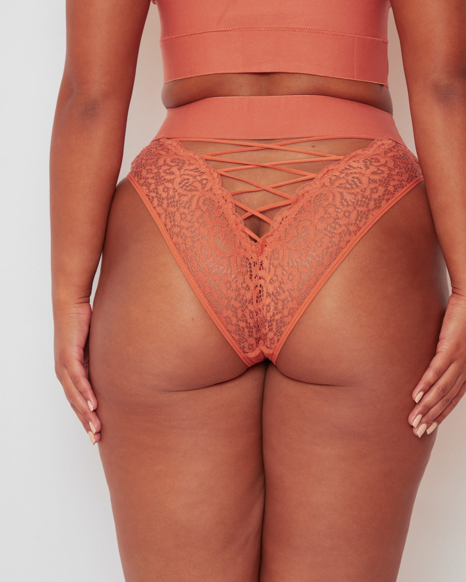 Close-up of the back of the Maya Brief, showcasing intricate floral lace, lace-up detailing, and a flattering cheeky cut designed to accentuate your curves.
