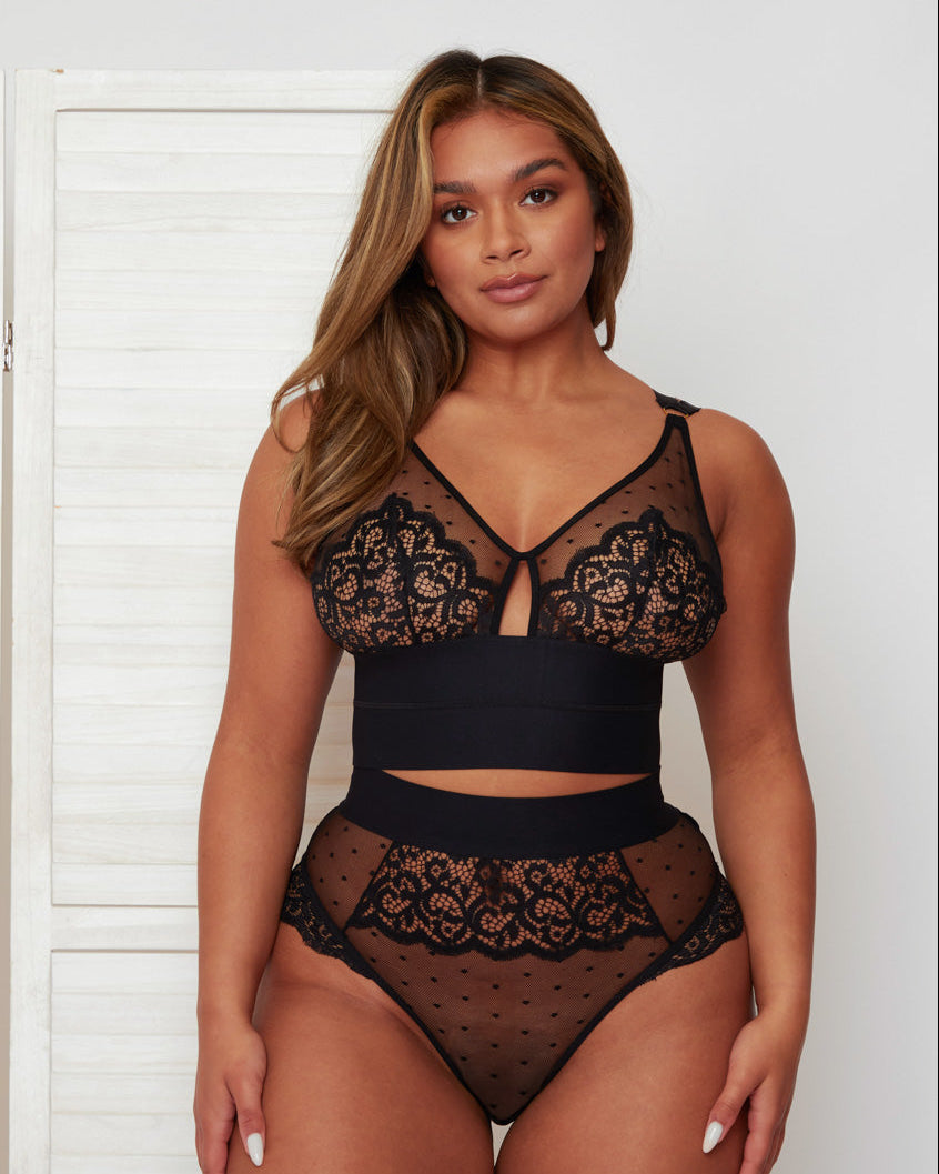Front view of the Morgon Bralette and Brief set in Midnight Black, featuring sheer polka-dot mesh, floral lace detailing, and a striking keyhole cut-out at the centre front. Wide elastic bands create a flattering, supportive silhouette.