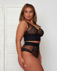 Side profile of the Morgon Bralette and Brief in Midnight Black, highlighting the combination of delicate lace, sheer mesh panels, and the high-waisted brief shape for a smooth, elegant fit.